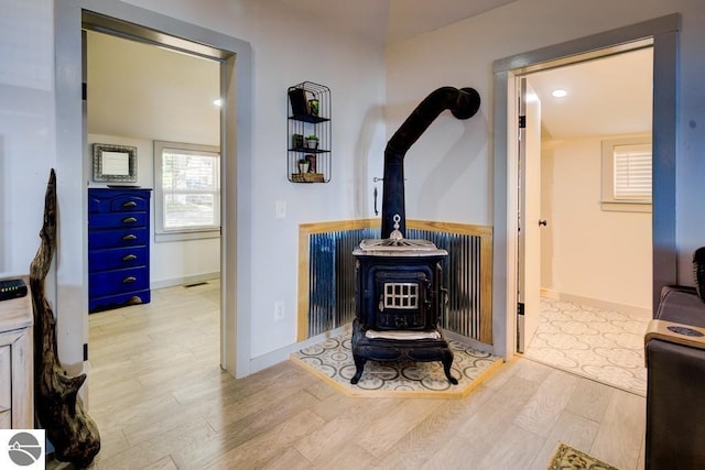 7600 Maple St, Grawn, MI 49637 - detailed view of a wood stove and wood finished floors