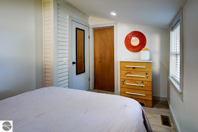 7600 Maple St, Grawn, MI 49637 - bedroom featuring baseboards and recessed lighting