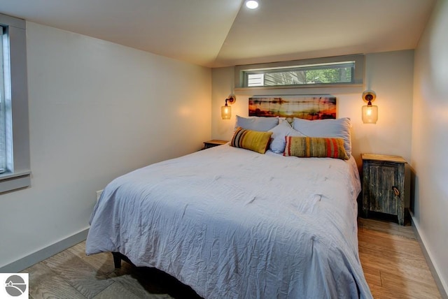 7600 Maple St, Grawn, MI 49637 - bedroom featuring wood finished floors and recessed lighting