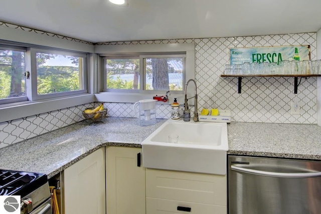 7600 Maple St, Grawn, MI 49637 - kitchen with stainless steel appliances, tasteful backsplash, light stone countertops, and open shelves