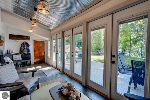 7600 Maple St, Grawn, MI 49637 - doorway featuring french doors, plenty of natural light, vaulted ceiling, and wood finished floors