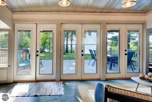 7600 Maple St, Grawn, MI 49637 - entryway featuring french doors and wood finished floors