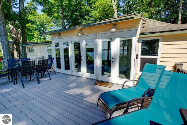 7600 Maple St, Grawn, MI 49637 - deck featuring french doors and outdoor dining area