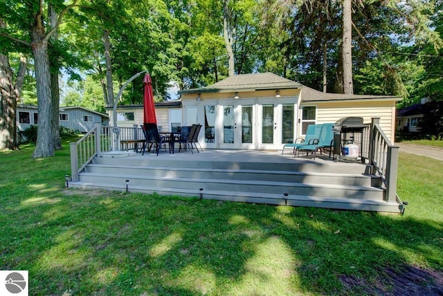 7600 Maple St, Grawn, MI 49637 - wooden deck with a yard and french doors