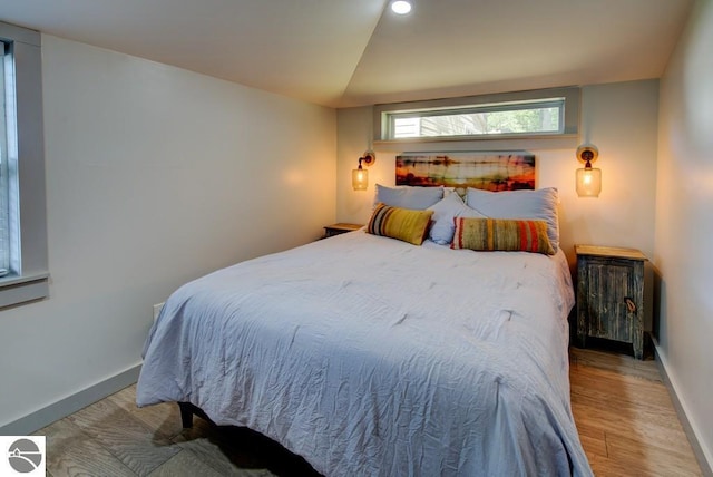 7600 Maple St, Grawn, MI 49637 - bedroom featuring wood finished floors and recessed lighting