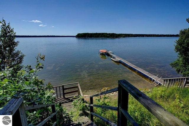 7600 Maple St, Grawn, MI 49637 - dock featuring a water view