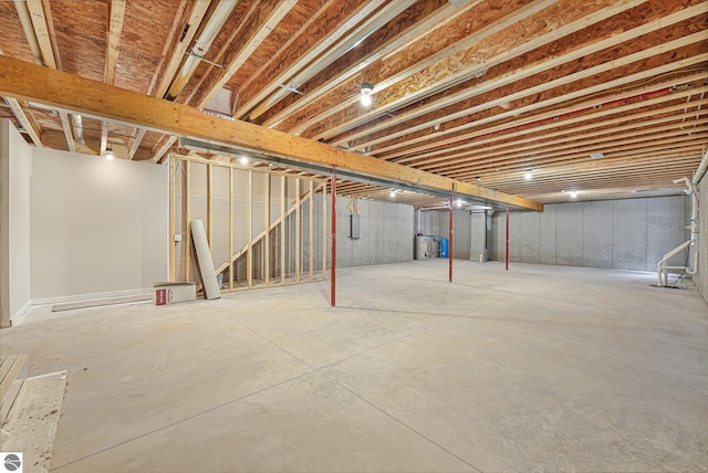 6483 Jeffrey Pl, Grawn, MI 49637 - unfinished basement featuring stairway