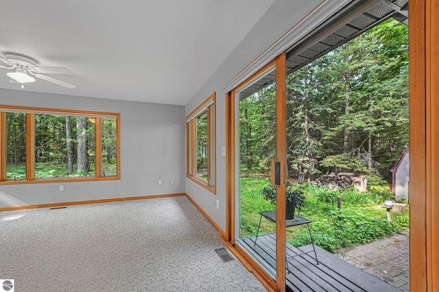 10085 Harmony Dr, Interlochen, MI 49643 - unfurnished sunroom featuring carpet and healthy amount of natural light