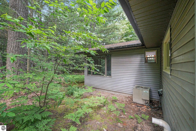 10085 Harmony Dr, Interlochen, MI 49643 - view of home's exterior with a cooling unit