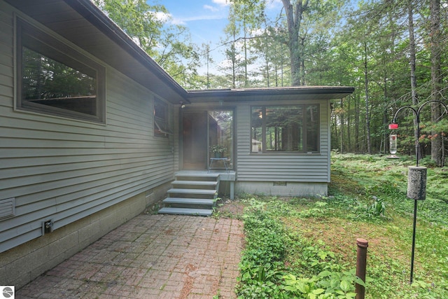 10085 Harmony Dr, Interlochen, MI 49643 - view of exterior entry with crawl space
