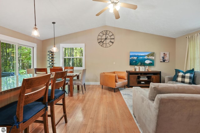 8315 Aimee Ln, Lake Ann, MI 49650 - dining area featuring light wood-style floors, plenty of natural light, ceiling fan, and lofted ceiling