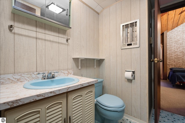 15910 E Cherry Park Dr, Northport, MI 49670 - bathroom featuring vanity and wooden walls