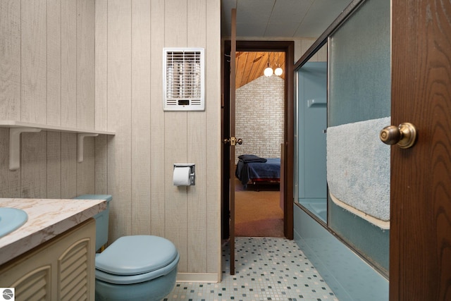 15910 E Cherry Park Dr, Northport, MI 49670 - bathroom featuring vanity, tile patterned floors, and wood walls
