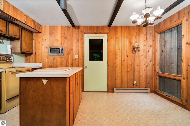 15910 E Cherry Park Dr, Northport, MI 49670 - kitchen featuring range with electric stovetop, stainless steel microwave, a baseboard radiator, beamed ceiling, and light countertops