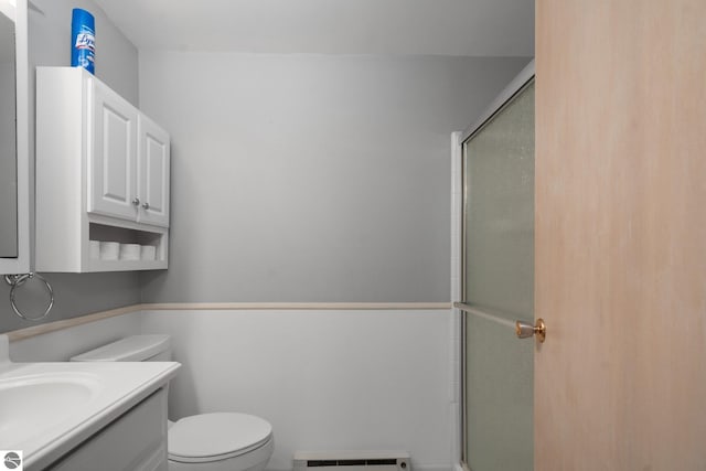 15910 E Cherry Park Dr, Northport, MI 49670 - bathroom with a baseboard heating unit, vanity, and an enclosed shower