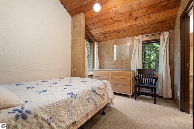 15910 E Cherry Park Dr, Northport, MI 49670 - bedroom featuring vaulted ceiling, multiple windows, light colored carpet, and wooden ceiling