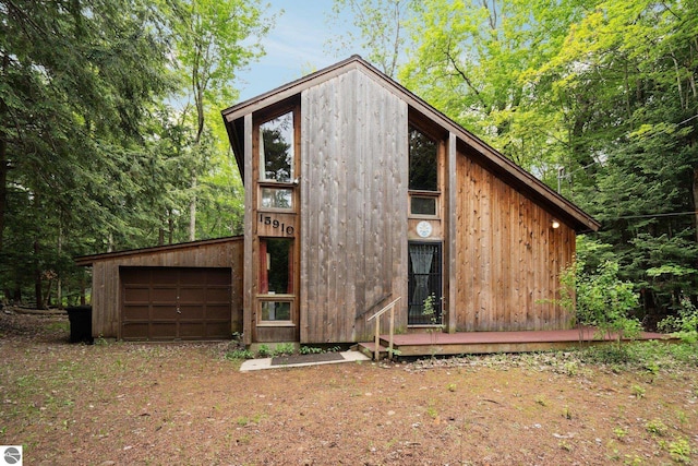 15910 E Cherry Park Dr, Northport, MI 49670 - view of outbuilding with a garage