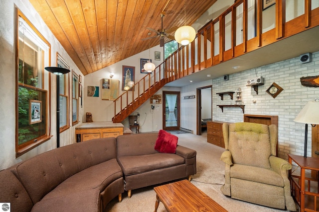 15910 E Cherry Park Dr, Northport, MI 49670 - living room with stairway, carpet flooring, wood ceiling, ceiling fan, and high vaulted ceiling