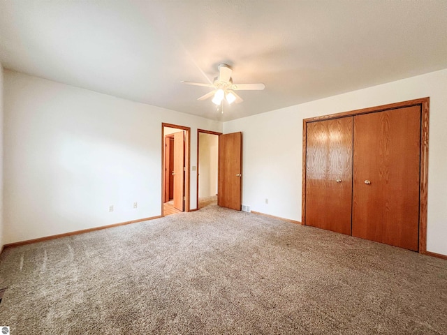3730 Driftwood Dr, Cadillac, MI 49601 - unfurnished bedroom featuring carpet floors, a closet, and a ceiling fan
