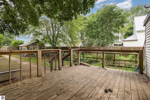 309 W Orchard Ave, Shepherd, MI 48883 - wooden deck with a fenced backyard