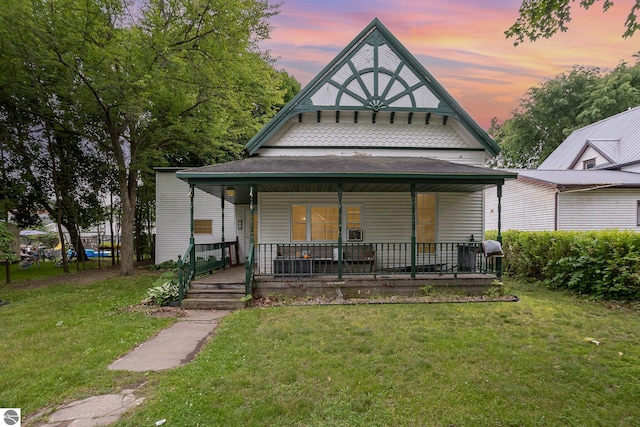 309 W Orchard Ave, Shepherd, MI 48883 - view of front of house with covered porch and a front yard