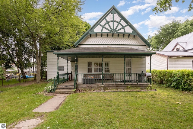 309 W Orchard Ave, Shepherd, MI 48883 - view of front facade with a porch and a front yard