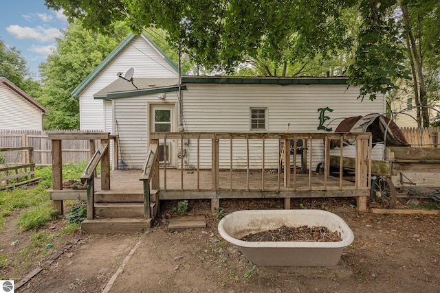 309 W Orchard Ave, Shepherd, MI 48883 - rear view of property with a wooden deck