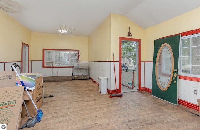 309 W Orchard Ave, Shepherd, MI 48883 - foyer featuring wood finished floors, a wainscoted wall, ceiling fan, lofted ceiling, and cooling unit