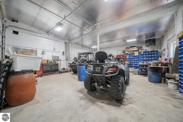 100 S Bullock St, Whittemore, MI 48770 - garage featuring a workshop area