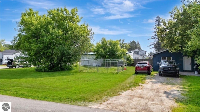100 S Bullock St, Whittemore, MI 48770 - view of front of house featuring a residential view and driveway