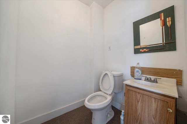100 S Bullock St, Whittemore, MI 48770 - bathroom with vanity and toilet