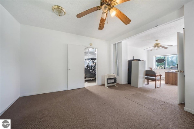 100 S Bullock St, Whittemore, MI 48770 - spare room featuring heating unit, a ceiling fan, and carpet