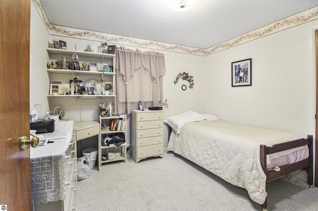 611 Sunset Ln, Cadillac, MI 49601 - bedroom with light carpet