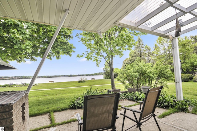611 Sunset Ln, Cadillac, MI 49601 - view of patio featuring a water view