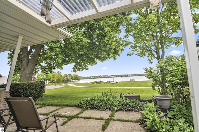 611 Sunset Ln, Cadillac, MI 49601 - view of patio featuring a water view and view of golf course