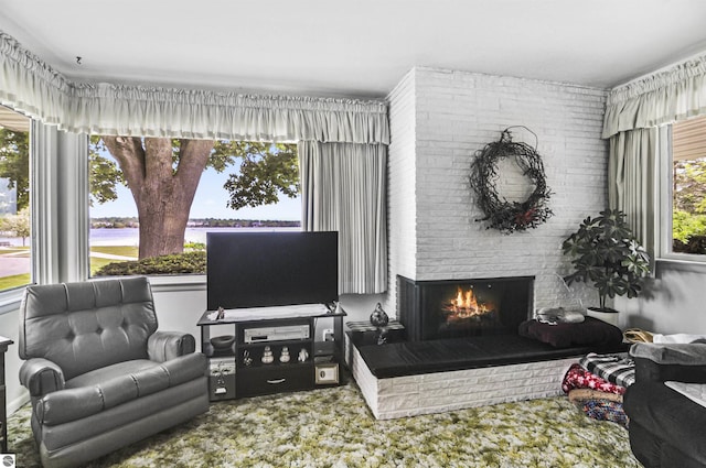611 Sunset Ln, Cadillac, MI 49601 - carpeted living room with a fireplace