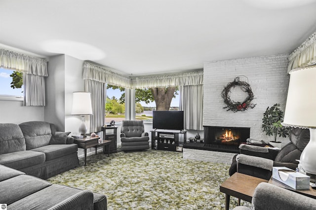611 Sunset Ln, Cadillac, MI 49601 - carpeted living room featuring healthy amount of natural light and a brick fireplace