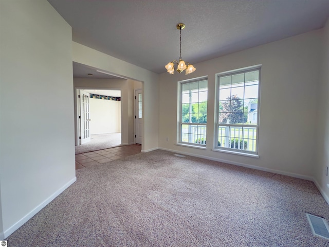 318 Red Maple Ln, Shepherd, MI 48883 - carpeted empty room featuring a chandelier and tile patterned floors