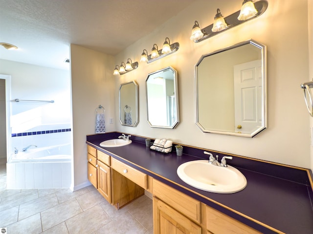 318 Red Maple Ln, Shepherd, MI 48883 - bathroom featuring double vanity, a bath, tile patterned floors, and a textured ceiling