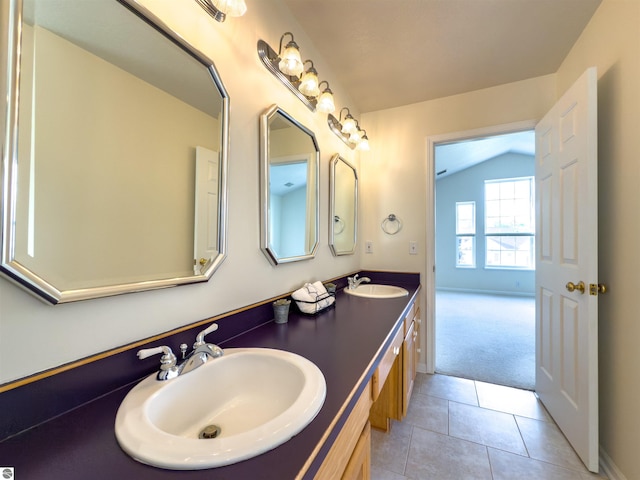 318 Red Maple Ln, Shepherd, MI 48883 - bathroom featuring vaulted ceiling, double vanity, and tile patterned flooring