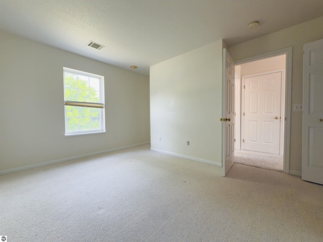 318 Red Maple Ln, Shepherd, MI 48883 - empty room with light carpet and a smoke detector