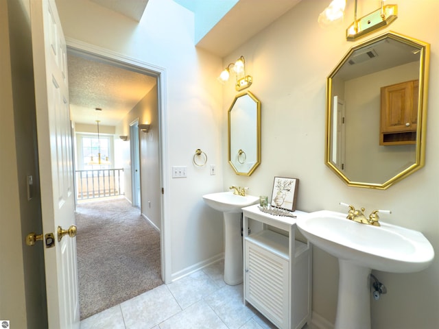 318 Red Maple Ln, Shepherd, MI 48883 - bathroom with tile patterned flooring and a textured ceiling
