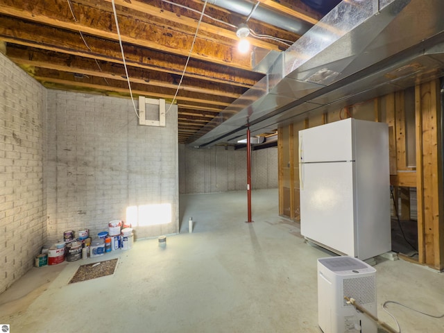 318 Red Maple Ln, Shepherd, MI 48883 - basement featuring freestanding refrigerator