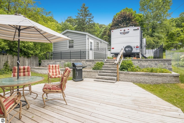 10884 Platte St, Honor, MI 49640 - deck featuring stairs and area for grilling