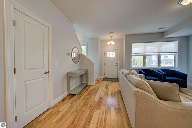 982 Lake Ridge Dr Unit 10, Traverse City, MI 49684 - entrance foyer with light wood-style flooring and baseboards