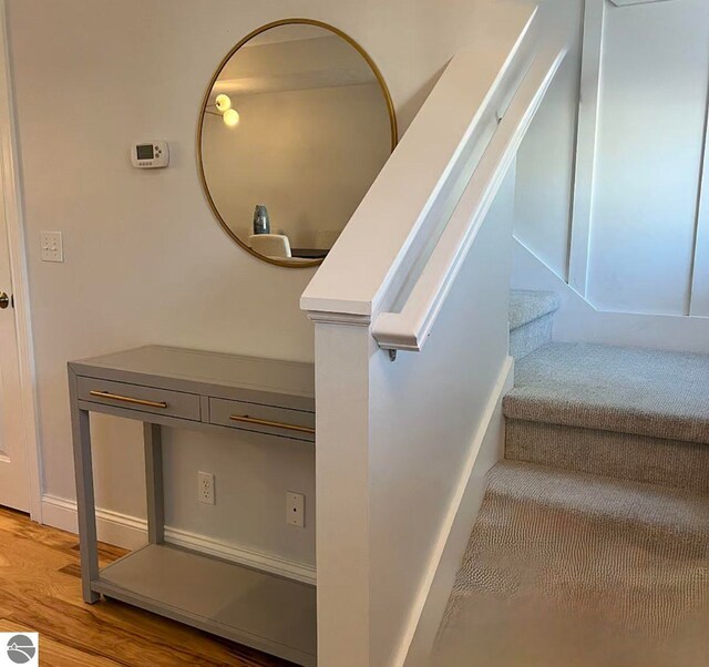 982 Lake Ridge Dr Unit 10, Traverse City, MI 49684 - stairway with wood finished floors