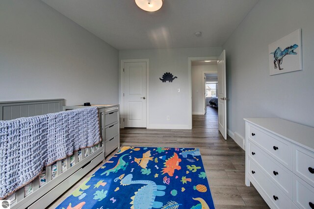 982 Lake Ridge Dr Unit 10, Traverse City, MI 49684 - bedroom featuring wood finished floors