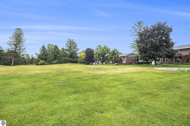 6022 Holt Rd Unit 2, Williamsburg, MI 49690 - view of grassy yard