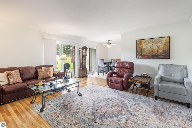 6022 Holt Rd Unit 2, Williamsburg, MI 49690 - living area featuring light wood-type flooring, crown molding, and ceiling fan
