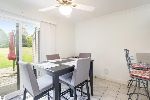 6022 Holt Rd Unit 2, Williamsburg, MI 49690 - dining room featuring ornamental molding, a ceiling fan, and light tile patterned floors